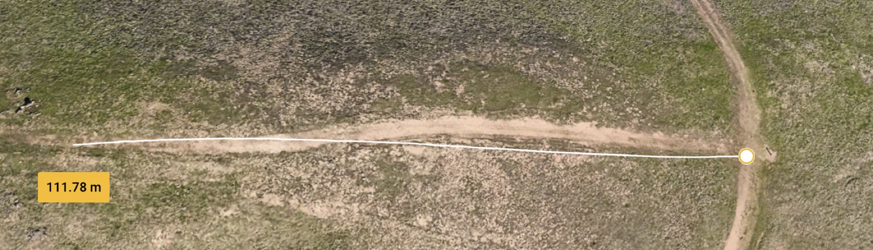 Aerial range measurement showing a 111.78 meter span between two points